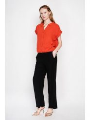 Le Jardin du Lin Bluzka w kolorze pomarańczowym rozmiar: 36. Pomarańczowe bluzki Le jardin du lin, bez wzorów, bez kołnierzyka, bez ramiączek. Za 100.99 zł.