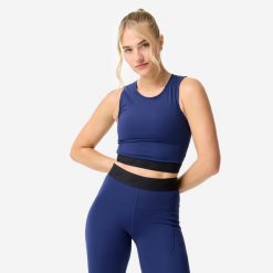 Koszulka fitness damska Domyos crop top. Niebieskie koszulki sportowe DOMYOS, bez wzorów, z elastanu, bez ramiączek, na fitness i siłownię. Za 69.99 zł.