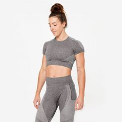 Koszulka fitness damska Domyos krótki rękaw. Czarne biustonosze DOMYOS, bez wzorów, z materiału. W wyprzedaży za 59.99 zł.