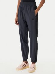 Adidas Spodnie dresowe Train Essentials 3-Stripes Woven KC5496 Czarny Regular Fit. Czarne spodnie dresowe Adidas, s, bez wzorów, z dresówki, na fitness i siłownię. Za 219.99 zł.