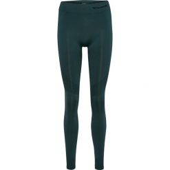 Damskie legginsy bezszwowe z wysokim stanem Hummel Shaping. Zielone legginsy Hummel, bez wzorów, z materiału, z podwyższonym stanem, na jogę i pilates. Za 164.00 zł.