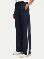 Guess Spodnie dresowe V6YB08 K4286 Granatowy Regular Fit. Niebieskie spodnie dresowe Guess, xs, z aplikacjami, z dresówki. Za 434.99 zł.