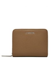 Calvin Klein Mały Portfel Damski Ck Must Md Zip Around_Caviar K60K612831 Beżowy. Brązowe portfele Calvin Klein, bez wzorów, ze skóry. Za 179.99 zł.