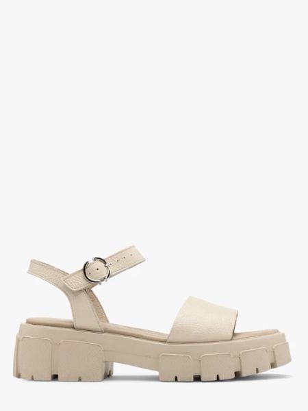 Kremowe sandały ze srebrną sprzączką. Brązowe sandały Ryłko, bez wzorów, ze skóry, bez obcasa, bez zapięcia. Za 329.99 zł.