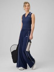 4F Spodnie dresowe z szerokimi nogawkami damskie - granatowe L. Niebieskie spodnie dresowe 4f, na co dzień, l, bez wzorów, z bawełny, z podwyższonym stanem, długie. Za 159.99 zł.