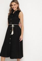 Czarna Koszulowa Sukienka z Wiskozy o Rozkoszowanym Kroju Wiązaniem z Frędzlami Zenbia. Czarne sukienki Born2be, na co dzień, l, bez wzorów, z jeansu, eleganckie, bez kołnierzyka, bez ramiączek, midi, kopertowe. Za 99.99 zł.