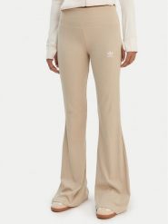 Adidas Legginsy Essentials KD3850 Beżowy Flared Leg. Brązowe legginsy Adidas, xs, bez wzorów, z bawełny. Za 219.99 zł.