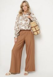 Jasnobrązowy Komplet Wiskozowy z Koszulą w Kwiaty i Szerokimi Spodniami Hanalore. Brązowe koszule Born2be, l, bez wzorów, z materiału, eleganckie, bez kołnierzyka, bez ramiączek. Za 129.99 zł.