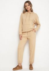Ciemnobeżowy Komplet Dresowy Bluza z Kapturem i Kangurową Kieszenią i Spodnie Liriela. Brązowe bluzy Born2be, l, bez wzorów, z dresówki, z kapturem. Za 79.99 zł.