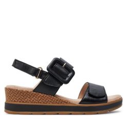 Sandały Caprice. Czarne sandały Caprice, bez wzorów, bez obcasa, na koturnie, bez zapięcia. Za 229.99 zł.