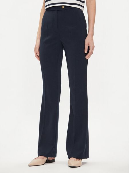 Tommy Hilfiger Spodnie materiałowe Gold Button WW0WW42455 Granatowy Flare Fit. Niebieskie spodnie materiałowe TOMMY HILFIGER, bez wzorów, z materiału. Za 349.99 zł.
