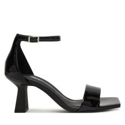 Sandały DKNY. Czarne sandały DKNY, bez wzorów, bez obcasa, na słupku, bez zapięcia. Za 579.99 zł.