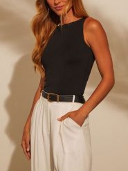 Milan Kiss Top w kolorze czarnym rozmiar: M. Czarne topy Milan Kiss, m, bez wzorów, z bawełny, bez kołnierzyka, bez ramiączek. Za 113.99 zł.