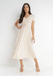 Jasnobeżowa Sukienka Ionene. Brązowe sukienki Born2be, na co dzień, na lato, l, bez wzorów, bez kołnierzyka, bez ramiączek, midi, proste. Za 119.99 zł.