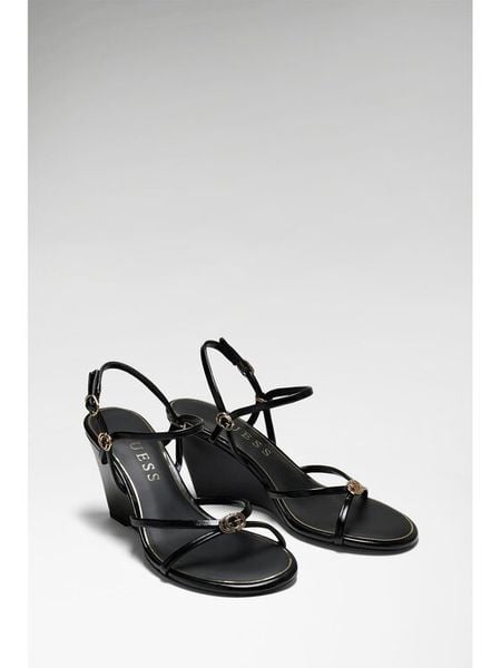 Guess Sandały FLTDVV PAF04 Czarny. Czarne sandały Guess, z aplikacjami, ze skóry, bez obcasa, na koturnie, bez zapięcia. Za 494.99 zł.