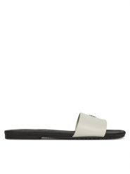 Calvin Klein Jeans Klapki Flat Sandal Slide Mg YW0YW01697 Biały. Białe klapki Calvin Klein Jeans, bez wzorów, z jeansu, bez obcasa. Za 209.99 zł.