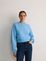 Bawełniana bluza - jasnoniebieski. Niebieskie bluzy Reserved, l, bez wzorów, z bawełny, bez kaptura. W wyprzedaży za 39.99 zł.