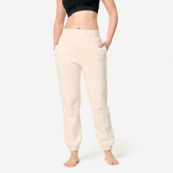Spodnie dresowe damskie Domyos Gym & Pilates. Brązowe spodnie dresowe DOMYOS, l, bez wzorów, z bawełny, na fitness i siłownię. Za 109.99 zł.