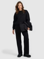 4F Spodnie dresowe z szerokimi nogawkami damskie - czarne XL. Czarne spodnie dresowe 4f, xl, bez wzorów, z dresówki. Za 169.99 zł.
