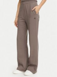 Calvin Klein Jeans Spodnie dresowe Monogram LV047H220G Beżowy ciemny Flare Fit. Brązowe spodnie dresowe Calvin Klein Jeans, s, bez wzorów, z bawełny. Za 369.99 zł.
