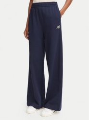 Lacoste Spodnie dresowe XF8392 Granatowy Flare Fit. Niebieskie spodnie dresowe Lacoste, bez wzorów, z bawełny. Za 579.99 zł.