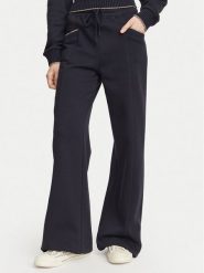 Guess Spodnie dresowe W6YB31 K5319 Granatowy Wide Leg. Niebieskie spodnie dresowe Guess, xs, z aplikacjami, z bawełny. Za 434.99 zł.