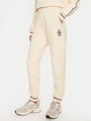 Guess Spodnie dresowe Nia V4BB06 KCHU1 Beżowy Regular Fit. Brązowe spodnie dresowe Guess, m, z aplikacjami, z bawełny. Za 379.99 zł.