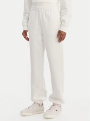 Lacoste Spodnie dresowe XF5244 Écru Regular Fit. Spodnie dresowe Lacoste, bez wzorów, z dresówki. Za 639.99 zł.