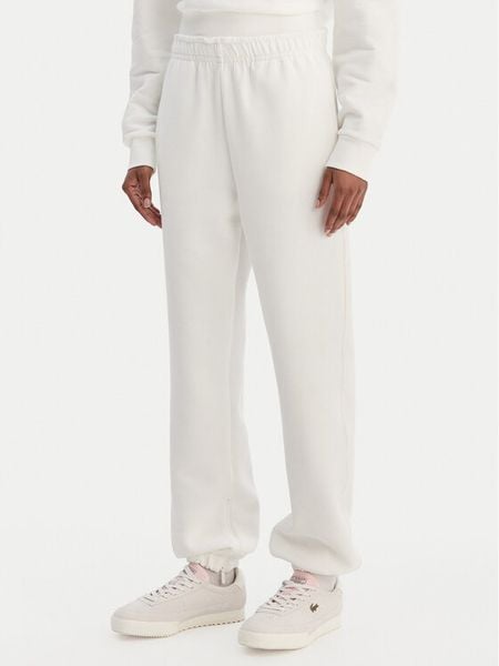 Lacoste Spodnie dresowe XF5244 Écru Regular Fit. Spodnie dresowe Lacoste, bez wzorów, z dresówki. Za 639.99 zł.