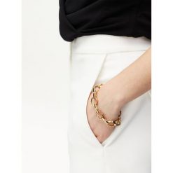Bransoletka Guess. Żółte bransoletki Guess, złote. Za 319.99 zł.