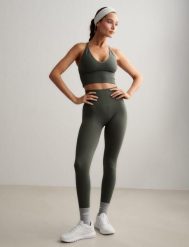 Damskie legginsy bezszwowe, wysoki stan, squat proof petite Shape zielony ivy. Zielone legginsy AIM'N, xl, bez wzorów, z elastanu, z podwyższonym stanem. Za 297.00 zł.