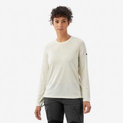 Koszulka trekkingowa damska z długim rękawem Merino Resist undyed. Białe bluzki FORCLAZ, l, bez wzorów, z materiału, sportowe, bez kołnierzyka, bez ramiączek. Za 199.99 zł.