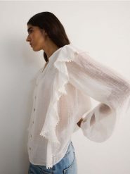 Koszula z falbanką z lyocellem - biały. Białe koszule Reserved, l, bez wzorów, z lyocellu, bez kołnierzyka, bez ramiączek. W wyprzedaży za 59.99 zł.