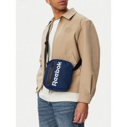 Saszetka Reebok. Niebieskie torby na ramię Reebok, bez wzorów, młodzieżowe, bez dodatków. Za 59.99 zł.