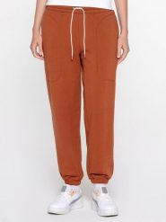 Puma Spodnie dresowe "Infuse" w kolorze jasnobrązowym rozmiar: M. Brązowe spodnie dresowe Puma, m, bez wzorów, z dresówki. Za 135.49 zł.