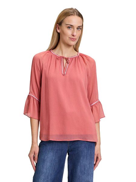 CARTOON Bluzka w kolorze łososiowym rozmiar: 40. Pomarańczowe bluzki Cartoon, z aplikacjami, bez kołnierzyka, bez ramiączek. Za 87.40 zł.