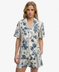 Superdry Koszula krótki rękaw Beach w kwiaty Jeane Floral Cream. Białe koszule Superdry, bez wzorów, z bawełny, bez kołnierzyka, bez ramiączek. Za 234.25 zł.