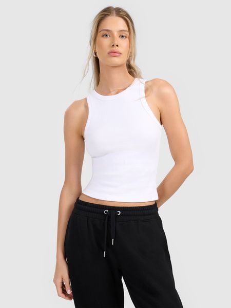 4F Top slim z prążkowanej dzianiny damski - biały S. Białe topy 4f, l, bez wzorów, z dzianiny, bez kołnierzyka, bez ramiączek. Za 49.99 zł.