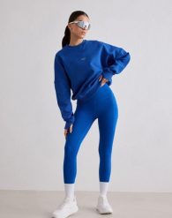 Damskie legginsy biegowe 7/8 wysoki stan, squat proof, kieszenie Le Run lazurowe. Niebieskie legginsy AIM'N, xs, bez wzorów, z elastanu, z podwyższonym stanem. Za 387.00 zł.