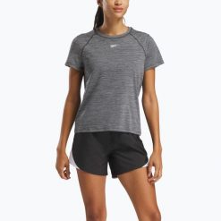 Koszulka Reebok Id Train Tee. Czarne bluzki REEBOK FITNESS, bez wzorów, sportowe, bez kołnierzyka, bez ramiączek. Za 79.99 zł.