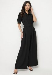 Czarny Taliowany Kombinezon z Ozdobną Klamrą Filateia. Czarne sukienki Born2be, m, bez wzorów, eleganckie, bez kołnierzyka, bez ramiączek. Za 119.99 zł.