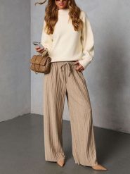 Milan Kiss Spodnie w kolorze beżowym rozmiar: XL. Brązowe spodnie materiałowe Milan Kiss, na co dzień, xl, bez wzorów, z materiału. Za 208.99 zł.