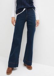Dżinsy z szerokimi nogawkami, talią mid waist i wygodnym stretchem. Niebieskie jeansy bonprix, bez wzorów. Za 129.99 zł.