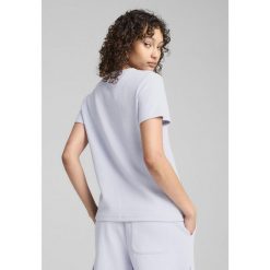 Damska koszulka HER PUMA Cool Weather Blue. Niebieskie koszulki sportowe Puma, bez wzorów, bez ramiączek. W wyprzedaży za 89.00 zł.