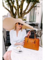 Lia Biassoni Skórzana torebka "Acco" w kolorze karmelowym - 32 x 22 x 12 cm rozmiar: onesize. Brązowe torby na ramię Lia Biassoni, bez wzorów, z materiału, na ramię, bez dodatków. Za 361.13 zł.