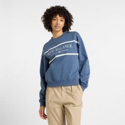 Bluza damska New Balance WT51923VTI – niebieska. Niebieskie bluzy New Balance, m, z aplikacjami, z bawełny, bez kaptura. Za 249.99 zł.