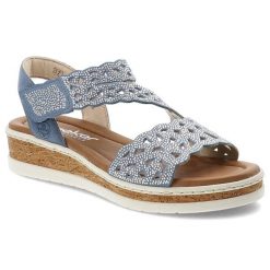 Sandały damskie Rieker, cholewka ze skóry ekologicznej z ażurowym wzorem i zdobieniami z kryształków regulowane zapięcie na rzep, niebieskie, V4150-1. Niebieskie sandały Rieker, z aplikacjami, ze skóry ekologicznej, eleganckie, bez obcasa, na koturnie, bez zapięcia. Za 296.90 zł.