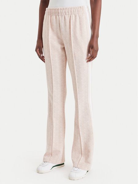 Lacoste Spodnie dresowe XF9313 Różowy jasny Regular Fit. Czerwone spodnie dresowe Lacoste, bez wzorów, z bawełny. Za 769.99 zł.