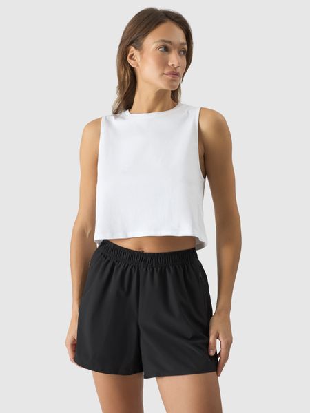 4F Crop-top oversize gładki damski - biały L. Białe topy 4f, l, bez wzorów, z bawełny, bez kołnierzyka, bez ramiączek. W wyprzedaży za 29.99 zł.