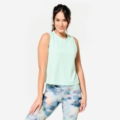 Koszulka bez rękawów damska Domyos Gym & Pilates Crop Top. Niebieskie koszulki sportowe DOMYOS, bez wzorów, z bawełny, bez ramiączek, na fitness i siłownię. Za 64.99 zł.
